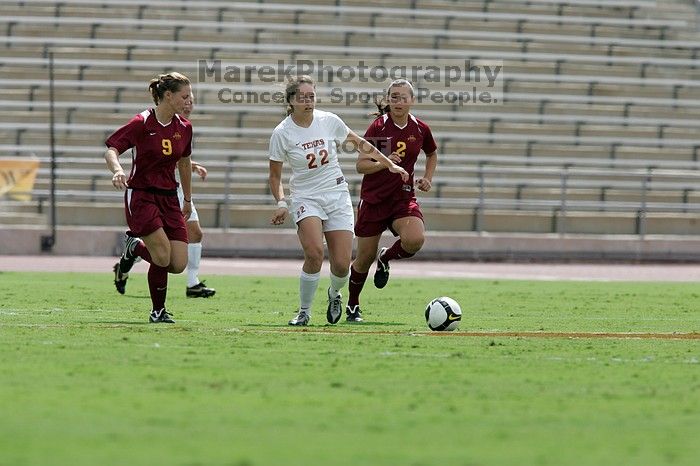 UT junior Stephanie Gibson (#22, Defense and Forward) passes the ball.  The University of Texas women's soccer team won 2-1 against the Iowa State Cyclones Sunday afternoon, October 5, 2008.

Filename: SRM_20081005_12314007.jpg
Aperture: f/5.6
Shutter Speed: 1/2500
Body: Canon EOS-1D Mark II
Lens: Canon EF 300mm f/2.8 L IS