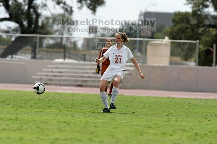 UT junior Emily Anderson (#21, Forward) passes the ball.  The University of Texas women's soccer team won 2-1 against the Iowa State Cyclones Sunday afternoon, October 5, 2008.

Filename: SRM_20081005_12314409.jpg
Aperture: f/5.6
Shutter Speed: 1/2500
Body: Canon EOS-1D Mark II
Lens: Canon EF 300mm f/2.8 L IS