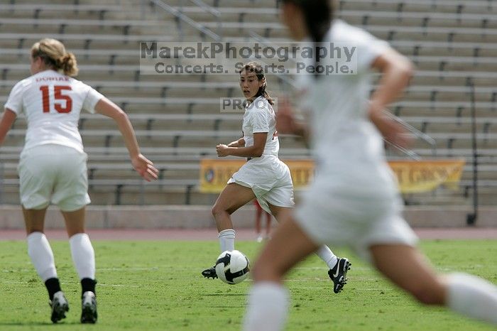 UT senior Stephanie Logterman (#10, Defender) runs with the ball.  The University of Texas women's soccer team won 2-1 against the Iowa State Cyclones Sunday afternoon, October 5, 2008.

Filename: SRM_20081005_12314812.jpg
Aperture: f/5.6
Shutter Speed: 1/2500
Body: Canon EOS-1D Mark II
Lens: Canon EF 300mm f/2.8 L IS