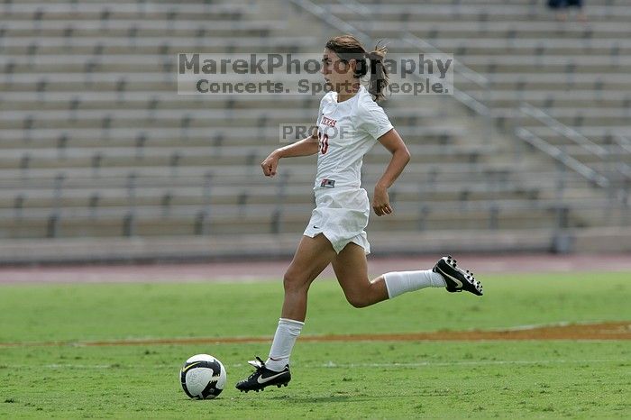 UT senior Stephanie Logterman (#10, Defender) runs with the ball.  The University of Texas women's soccer team won 2-1 against the Iowa State Cyclones Sunday afternoon, October 5, 2008.

Filename: SRM_20081005_12322815.jpg
Aperture: f/5.6
Shutter Speed: 1/2000
Body: Canon EOS-1D Mark II
Lens: Canon EF 300mm f/2.8 L IS