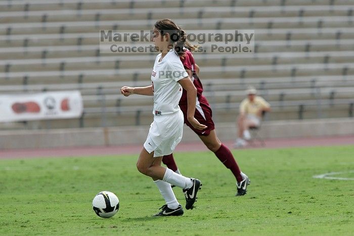 UT senior Stephanie Logterman (#10, Defender) runs with the ball.  The University of Texas women's soccer team won 2-1 against the Iowa State Cyclones Sunday afternoon, October 5, 2008.

Filename: SRM_20081005_12322818.jpg
Aperture: f/5.6
Shutter Speed: 1/2000
Body: Canon EOS-1D Mark II
Lens: Canon EF 300mm f/2.8 L IS