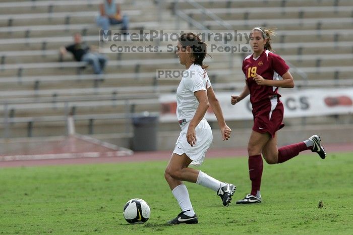 UT senior Stephanie Logterman (#10, Defender) runs with the ball.  The University of Texas women's soccer team won 2-1 against the Iowa State Cyclones Sunday afternoon, October 5, 2008.

Filename: SRM_20081005_12323021.jpg
Aperture: f/5.6
Shutter Speed: 1/2000
Body: Canon EOS-1D Mark II
Lens: Canon EF 300mm f/2.8 L IS