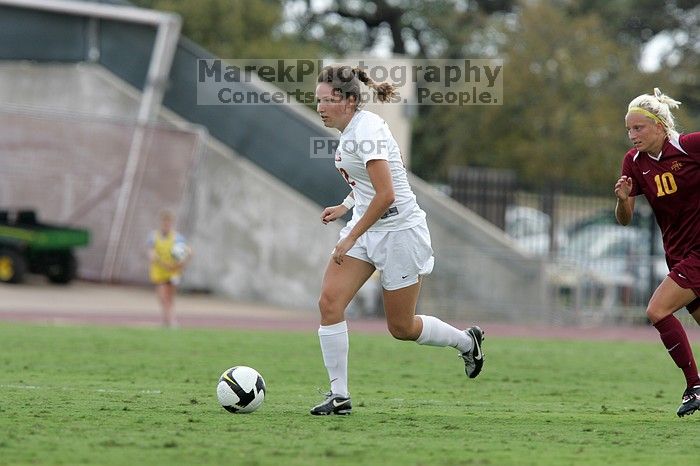 UT junior Stephanie Gibson (#22, Defense and Forward) steals the ball from an Iowa State player.  The University of Texas women's soccer team won 2-1 against the Iowa State Cyclones Sunday afternoon, October 5, 2008.

Filename: SRM_20081005_12364449.jpg
Aperture: f/5.6
Shutter Speed: 1/1000
Body: Canon EOS-1D Mark II
Lens: Canon EF 300mm f/2.8 L IS