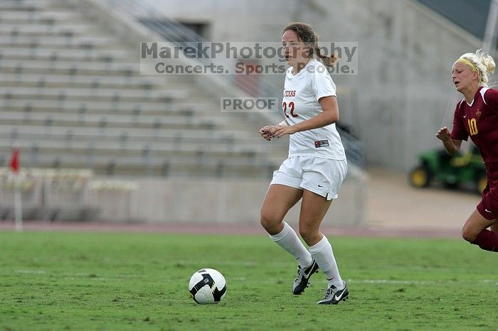 UT junior Stephanie Gibson (#22, Defense and Forward) steals the ball from an Iowa State player.  The University of Texas women's soccer team won 2-1 against the Iowa State Cyclones Sunday afternoon, October 5, 2008.

Filename: SRM_20081005_12364653.jpg
Aperture: f/5.6
Shutter Speed: 1/1250
Body: Canon EOS-1D Mark II
Lens: Canon EF 300mm f/2.8 L IS