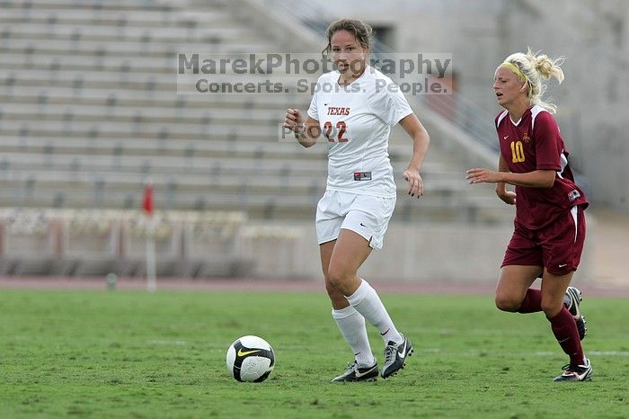 UT junior Stephanie Gibson (#22, Defense and Forward) steals the ball from an Iowa State player.  The University of Texas women's soccer team won 2-1 against the Iowa State Cyclones Sunday afternoon, October 5, 2008.

Filename: SRM_20081005_12364654.jpg
Aperture: f/5.6
Shutter Speed: 1/1250
Body: Canon EOS-1D Mark II
Lens: Canon EF 300mm f/2.8 L IS