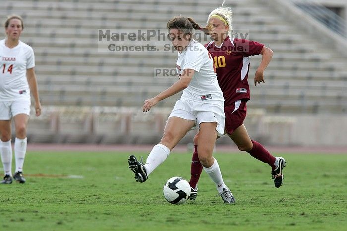 UT junior Stephanie Gibson (#22, Defense and Forward) steals the ball from an Iowa State player.  The University of Texas women's soccer team won 2-1 against the Iowa State Cyclones Sunday afternoon, October 5, 2008.

Filename: SRM_20081005_12364857.jpg
Aperture: f/5.6
Shutter Speed: 1/1250
Body: Canon EOS-1D Mark II
Lens: Canon EF 300mm f/2.8 L IS