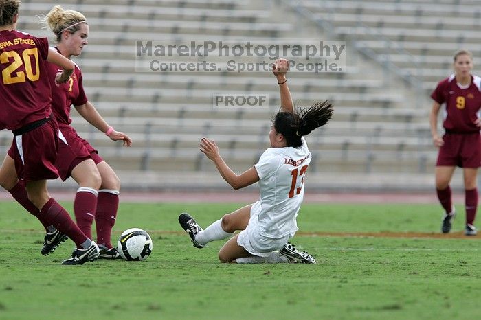 UT freshman Amanda Lisberger (#13, Midfielder) comes in for a slide tackle.  The University of Texas women's soccer team won 2-1 against the Iowa State Cyclones Sunday afternoon, October 5, 2008.

Filename: SRM_20081005_12371859.jpg
Aperture: f/5.6
Shutter Speed: 1/1250
Body: Canon EOS-1D Mark II
Lens: Canon EF 300mm f/2.8 L IS