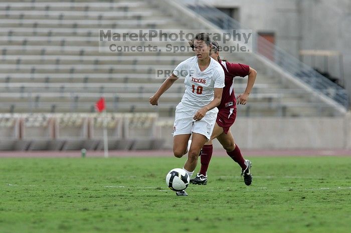 UT senior Stephanie Logterman (#10, Defender) makes a run with the ball.  The University of Texas women's soccer team won 2-1 against the Iowa State Cyclones Sunday afternoon, October 5, 2008.

Filename: SRM_20081005_12372460.jpg
Aperture: f/5.6
Shutter Speed: 1/1250
Body: Canon EOS-1D Mark II
Lens: Canon EF 300mm f/2.8 L IS