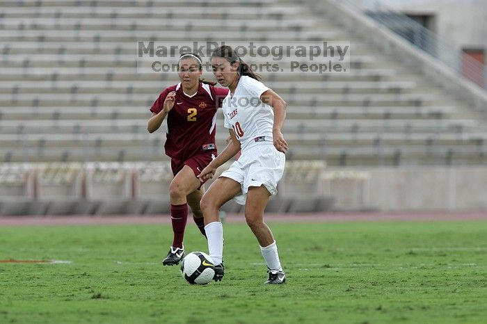 UT senior Stephanie Logterman (#10, Defender) makes a run with the ball.  The University of Texas women's soccer team won 2-1 against the Iowa State Cyclones Sunday afternoon, October 5, 2008.

Filename: SRM_20081005_12372462.jpg
Aperture: f/5.6
Shutter Speed: 1/1250
Body: Canon EOS-1D Mark II
Lens: Canon EF 300mm f/2.8 L IS