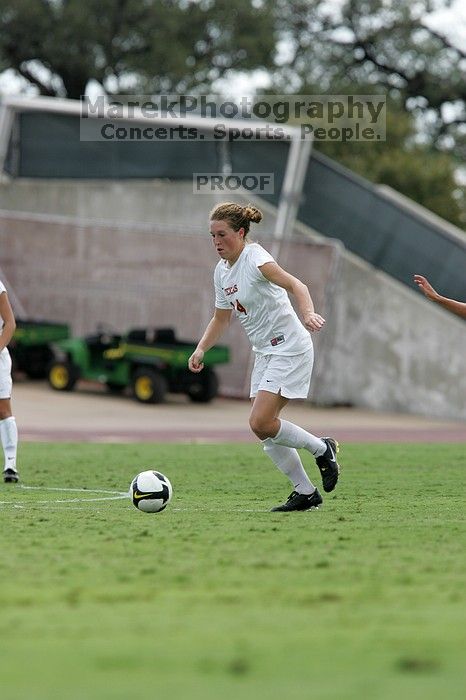 UT senior Kasey Moore (#14, Defender).  The University of Texas women's soccer team won 2-1 against the Iowa State Cyclones Sunday afternoon, October 5, 2008.

Filename: SRM_20081005_12392669.jpg
Aperture: f/5.6
Shutter Speed: 1/1000
Body: Canon EOS-1D Mark II
Lens: Canon EF 300mm f/2.8 L IS