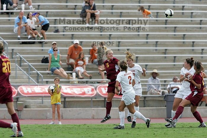 UT sophomore Kirsten Birkhold (#2, Forward and Midfielder) and UT sophomore Kate Nicholson (#17, Forward and Midfielder) fight for the header as UT junior Stephanie Gibson (#22, Defense and Forward) watches.  The University of Texas women's soccer team won 2-1 against the Iowa State Cyclones Sunday afternoon, October 5, 2008.

Filename: SRM_20081005_12410099.jpg
Aperture: f/5.6
Shutter Speed: 1/1000
Body: Canon EOS-1D Mark II
Lens: Canon EF 300mm f/2.8 L IS