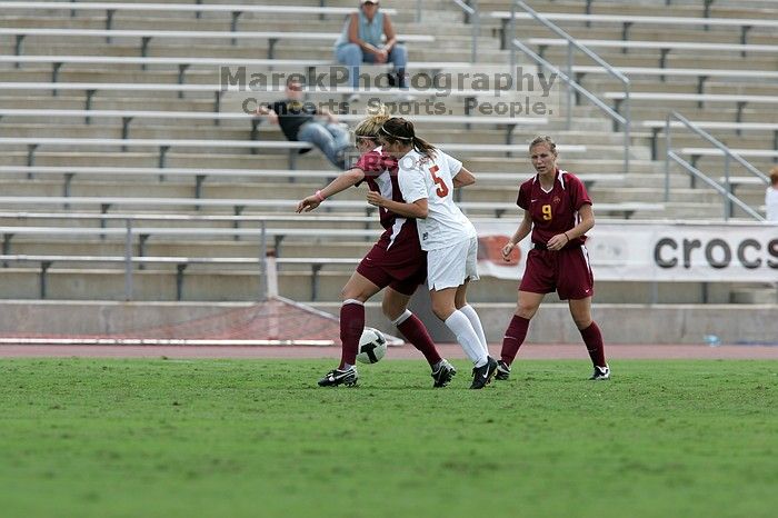 UT sophomore Kendall Campise (#5, Defender and Midfielder) plays defense on an Iowa State player.  The University of Texas women's soccer team won 2-1 against the Iowa State Cyclones Sunday afternoon, October 5, 2008.

Filename: SRM_20081005_12410202.jpg
Aperture: f/5.6
Shutter Speed: 1/1250
Body: Canon EOS-1D Mark II
Lens: Canon EF 300mm f/2.8 L IS