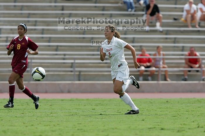 UT sophomore Kirsten Birkhold (#2, Forward and Midfielder) chases the ball down.  The University of Texas women's soccer team won 2-1 against the Iowa State Cyclones Sunday afternoon, October 5, 2008.

Filename: SRM_20081005_12412011.jpg
Aperture: f/5.6
Shutter Speed: 1/1600
Body: Canon EOS-1D Mark II
Lens: Canon EF 300mm f/2.8 L IS