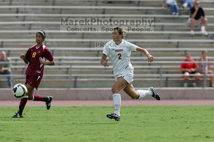 UT sophomore Kirsten Birkhold (#2, Forward and Midfielder) chases the ball down.  The University of Texas women's soccer team won 2-1 against the Iowa State Cyclones Sunday afternoon, October 5, 2008.

Filename: SRM_20081005_12412012.jpg
Aperture: f/5.6
Shutter Speed: 1/2000
Body: Canon EOS-1D Mark II
Lens: Canon EF 300mm f/2.8 L IS