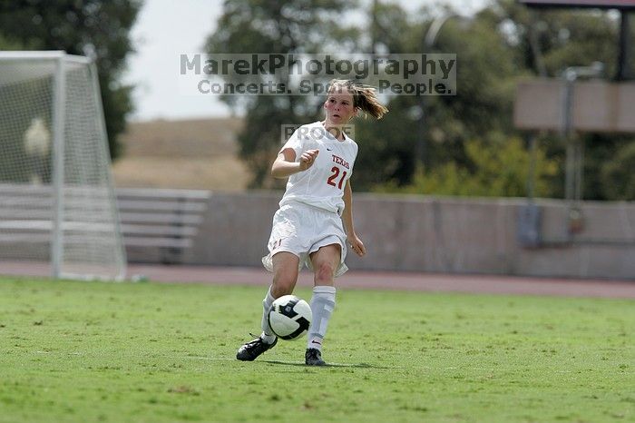 UT junior Emily Anderson (#21, Forward) passes the ball.  The University of Texas women's soccer team won 2-1 against the Iowa State Cyclones Sunday afternoon, October 5, 2008.

Filename: SRM_20081005_12413417.jpg
Aperture: f/5.6
Shutter Speed: 1/2000
Body: Canon EOS-1D Mark II
Lens: Canon EF 300mm f/2.8 L IS