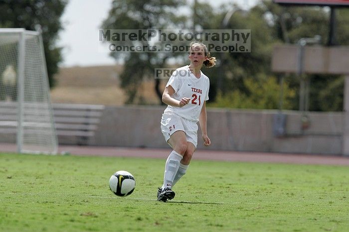 UT junior Emily Anderson (#21, Forward) passes the ball.  The University of Texas women's soccer team won 2-1 against the Iowa State Cyclones Sunday afternoon, October 5, 2008.

Filename: SRM_20081005_12413418.jpg
Aperture: f/5.6
Shutter Speed: 1/2000
Body: Canon EOS-1D Mark II
Lens: Canon EF 300mm f/2.8 L IS