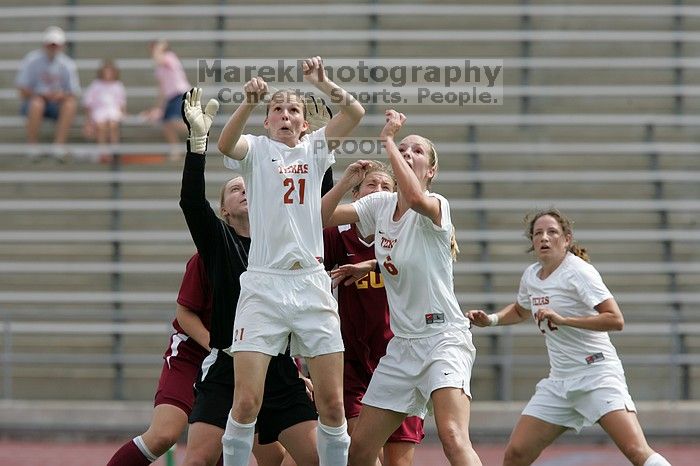 UT junior Emily Anderson (#21, Forward) and UT freshman Lucy Keith (#6, Midfielder) fight for the header with the keeper, as UT junior Stephanie Gibson (#22, Defense and Forward) watches.  The University of Texas women's soccer team won 2-1 against the Iowa State Cyclones Sunday afternoon, October 5, 2008.

Filename: SRM_20081005_12420419.jpg
Aperture: f/5.6
Shutter Speed: 1/1600
Body: Canon EOS-1D Mark II
Lens: Canon EF 300mm f/2.8 L IS