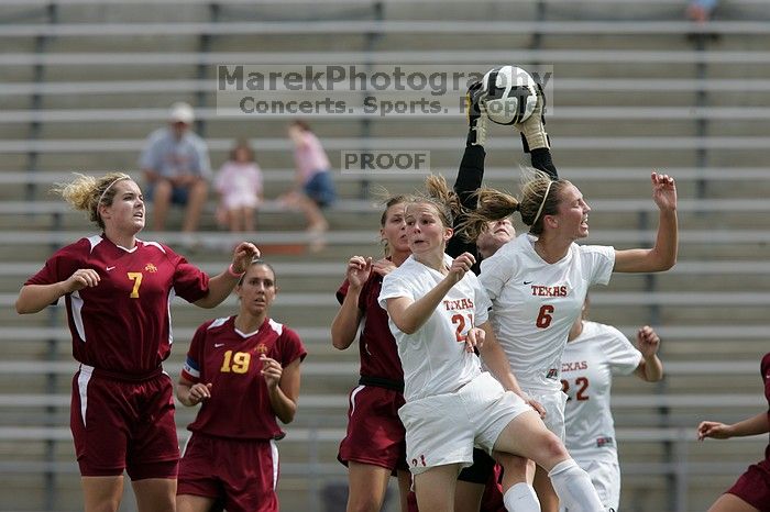 UT junior Emily Anderson (#21, Forward) and UT freshman Lucy Keith (#6, Midfielder) fight for the header with the keeper, as UT junior Stephanie Gibson (#22, Defense and Forward) watches.  The University of Texas women's soccer team won 2-1 against the Iowa State Cyclones Sunday afternoon, October 5, 2008.

Filename: SRM_20081005_12420623.jpg
Aperture: f/5.6
Shutter Speed: 1/2000
Body: Canon EOS-1D Mark II
Lens: Canon EF 300mm f/2.8 L IS