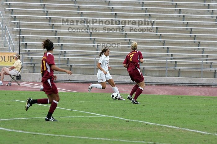 UT sophomore Alisha Ortiz (#12, Forward) in the second half.  The University of Texas women's soccer team won 2-1 against the Iowa State Cyclones Sunday afternoon, October 5, 2008.

Filename: SRM_20081005_13014677.jpg
Aperture: f/5.6
Shutter Speed: 1/1250
Body: Canon EOS-1D Mark II
Lens: Canon EF 300mm f/2.8 L IS