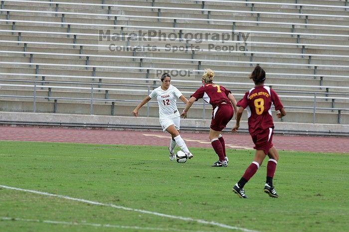 UT sophomore Alisha Ortiz (#12, Forward) in the second half.  The University of Texas women's soccer team won 2-1 against the Iowa State Cyclones Sunday afternoon, October 5, 2008.

Filename: SRM_20081005_13014881.jpg
Aperture: f/5.6
Shutter Speed: 1/1250
Body: Canon EOS-1D Mark II
Lens: Canon EF 300mm f/2.8 L IS