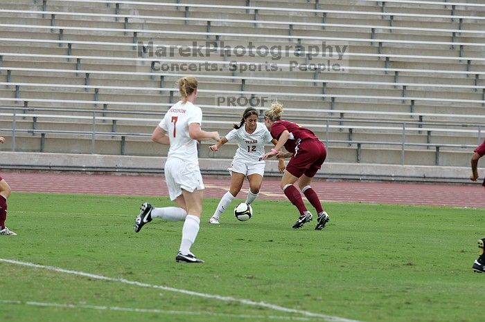 UT sophomore Alisha Ortiz (#12, Forward) in the second half.  The University of Texas women's soccer team won 2-1 against the Iowa State Cyclones Sunday afternoon, October 5, 2008.

Filename: SRM_20081005_13015084.jpg
Aperture: f/5.6
Shutter Speed: 1/1250
Body: Canon EOS-1D Mark II
Lens: Canon EF 300mm f/2.8 L IS