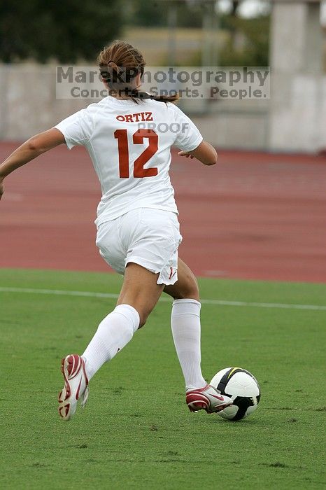 UT sophomore Alisha Ortiz (#12, Forward) in the second half.  The University of Texas women's soccer team won 2-1 against the Iowa State Cyclones Sunday afternoon, October 5, 2008.

Filename: SRM_20081005_13030220.jpg
Aperture: f/5.6
Shutter Speed: 1/1600
Body: Canon EOS-1D Mark II
Lens: Canon EF 300mm f/2.8 L IS