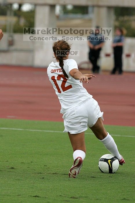 UT sophomore Alisha Ortiz (#12, Forward) in the second half.  The University of Texas women's soccer team won 2-1 against the Iowa State Cyclones Sunday afternoon, October 5, 2008.

Filename: SRM_20081005_13030423.jpg
Aperture: f/5.6
Shutter Speed: 1/1600
Body: Canon EOS-1D Mark II
Lens: Canon EF 300mm f/2.8 L IS