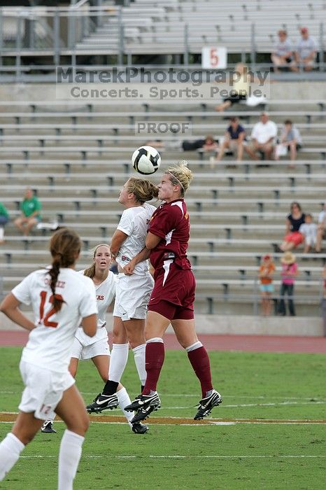 UT freshman Kylie Doniak (#15, Midfielder) fights for the header in the second half.  The University of Texas women's soccer team won 2-1 against the Iowa State Cyclones Sunday afternoon, October 5, 2008.

Filename: SRM_20081005_13044650.jpg
Aperture: f/5.6
Shutter Speed: 1/1250
Body: Canon EOS-1D Mark II
Lens: Canon EF 300mm f/2.8 L IS