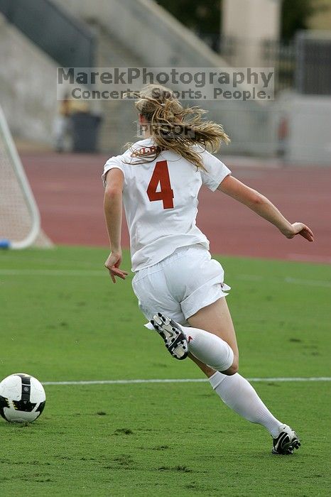 UT senior Jill Gilbeau (#4, Defender and Midfielder) makes a drive and then shot on goal in the second half.  The University of Texas women's soccer team won 2-1 against the Iowa State Cyclones Sunday afternoon, October 5, 2008.

Filename: SRM_20081005_13070077.jpg
Aperture: f/5.6
Shutter Speed: 1/1600
Body: Canon EOS-1D Mark II
Lens: Canon EF 300mm f/2.8 L IS