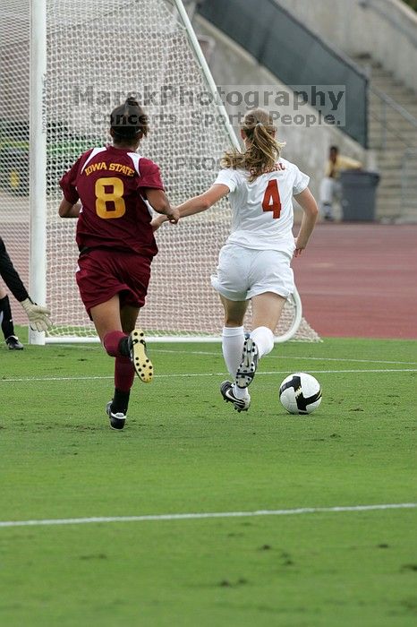 UT senior Jill Gilbeau (#4, Defender and Midfielder) makes a drive and then shot on goal in the second half.  The University of Texas women's soccer team won 2-1 against the Iowa State Cyclones Sunday afternoon, October 5, 2008.

Filename: SRM_20081005_13070485.jpg
Aperture: f/5.6
Shutter Speed: 1/1250
Body: Canon EOS-1D Mark II
Lens: Canon EF 300mm f/2.8 L IS