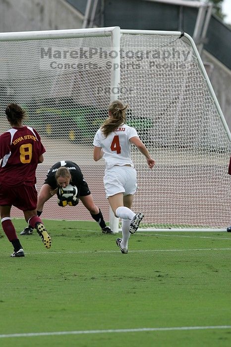 UT senior Jill Gilbeau (#4, Defender and Midfielder) makes a drive and then shot on goal in the second half.  The University of Texas women's soccer team won 2-1 against the Iowa State Cyclones Sunday afternoon, October 5, 2008.

Filename: SRM_20081005_13070690.jpg
Aperture: f/5.6
Shutter Speed: 1/1600
Body: Canon EOS-1D Mark II
Lens: Canon EF 300mm f/2.8 L IS