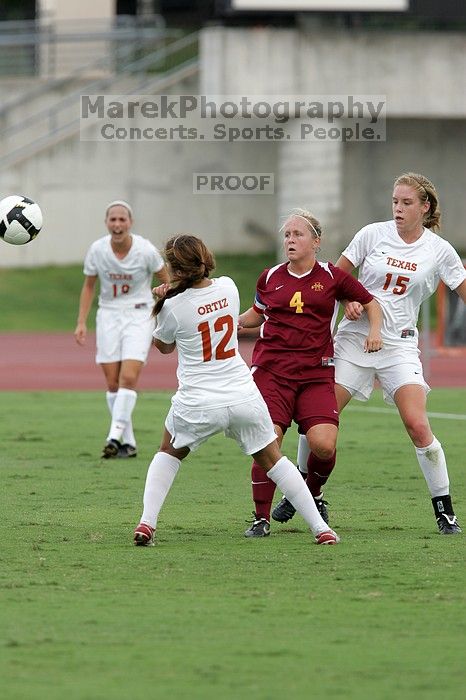 UT sophomore Alisha Ortiz (#12, Forward) waits for the header while UT freshman Kylie Doniak (#15, Midfielder) and UT sophomore Erica Campanelli (#19, Defender) watch, in the second half.  The University of Texas women's soccer team won 2-1 against the Iowa State Cyclones Sunday afternoon, October 5, 2008.

Filename: SRM_20081005_13125085.jpg
Aperture: f/5.6
Shutter Speed: 1/1000
Body: Canon EOS-1D Mark II
Lens: Canon EF 300mm f/2.8 L IS