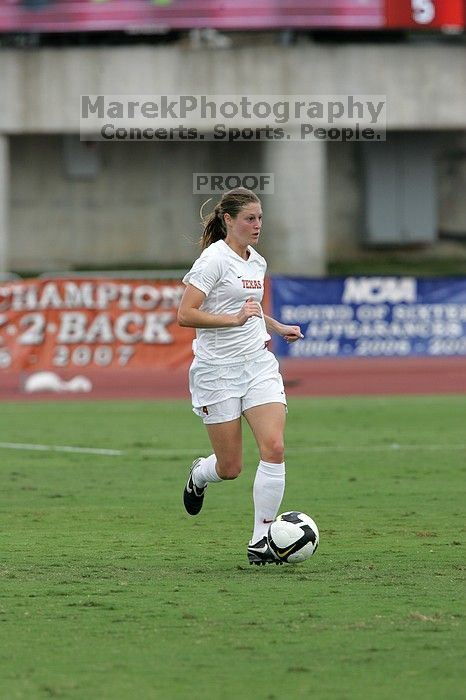 UT senior Jill Gilbeau (#4, Defender and Midfielder) dribbles the ball in the second half.  The University of Texas women's soccer team won 2-1 against the Iowa State Cyclones Sunday afternoon, October 5, 2008.

Filename: SRM_20081005_13145800.jpg
Aperture: f/5.6
Shutter Speed: 1/1250
Body: Canon EOS-1D Mark II
Lens: Canon EF 300mm f/2.8 L IS