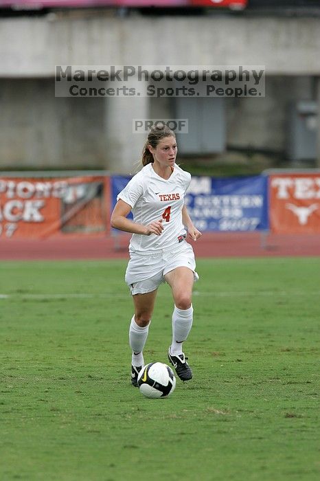 UT senior Jill Gilbeau (#4, Defender and Midfielder) dribbles the ball in the second half.  The University of Texas women's soccer team won 2-1 against the Iowa State Cyclones Sunday afternoon, October 5, 2008.

Filename: SRM_20081005_13145802.jpg
Aperture: f/5.6
Shutter Speed: 1/1000
Body: Canon EOS-1D Mark II
Lens: Canon EF 300mm f/2.8 L IS