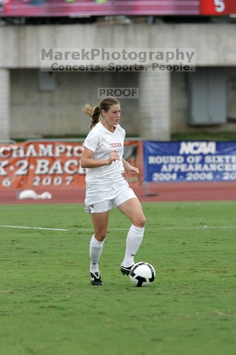 UT senior Jill Gilbeau (#4, Defender and Midfielder) dribbles the ball in the second half.  The University of Texas women's soccer team won 2-1 against the Iowa State Cyclones Sunday afternoon, October 5, 2008.

Filename: SRM_20081005_13145899.jpg
Aperture: f/5.6
Shutter Speed: 1/1250
Body: Canon EOS-1D Mark II
Lens: Canon EF 300mm f/2.8 L IS