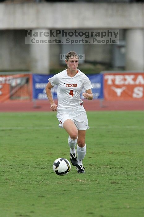 UT senior Jill Gilbeau (#4, Defender and Midfielder) dribbles the ball in the second half.  The University of Texas women's soccer team won 2-1 against the Iowa State Cyclones Sunday afternoon, October 5, 2008.

Filename: SRM_20081005_13150004.jpg
Aperture: f/5.6
Shutter Speed: 1/1000
Body: Canon EOS-1D Mark II
Lens: Canon EF 300mm f/2.8 L IS