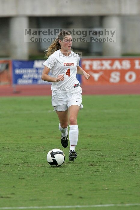 UT senior Jill Gilbeau (#4, Defender and Midfielder) dribbles the ball in the second half.  The University of Texas women's soccer team won 2-1 against the Iowa State Cyclones Sunday afternoon, October 5, 2008.

Filename: SRM_20081005_13150005.jpg
Aperture: f/5.6
Shutter Speed: 1/1250
Body: Canon EOS-1D Mark II
Lens: Canon EF 300mm f/2.8 L IS