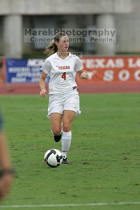 UT senior Jill Gilbeau (#4, Defender and Midfielder) dribbles the ball in the second half.  The University of Texas women's soccer team won 2-1 against the Iowa State Cyclones Sunday afternoon, October 5, 2008.

Filename: SRM_20081005_13150006.jpg
Aperture: f/5.6
Shutter Speed: 1/1250
Body: Canon EOS-1D Mark II
Lens: Canon EF 300mm f/2.8 L IS