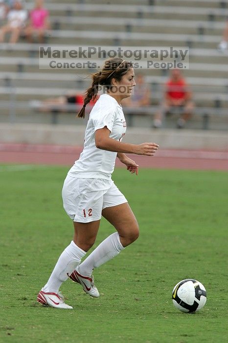 UT sophomore Alisha Ortiz (#12, Forward) in the second half.  The University of Texas women's soccer team won 2-1 against the Iowa State Cyclones Sunday afternoon, October 5, 2008.

Filename: SRM_20081005_13150411.jpg
Aperture: f/5.6
Shutter Speed: 1/1000
Body: Canon EOS-1D Mark II
Lens: Canon EF 300mm f/2.8 L IS