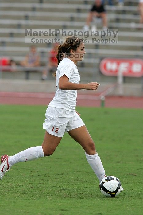 UT sophomore Alisha Ortiz (#12, Forward) in the second half.  The University of Texas women's soccer team won 2-1 against the Iowa State Cyclones Sunday afternoon, October 5, 2008.

Filename: SRM_20081005_13150412.jpg
Aperture: f/5.6
Shutter Speed: 1/1250
Body: Canon EOS-1D Mark II
Lens: Canon EF 300mm f/2.8 L IS