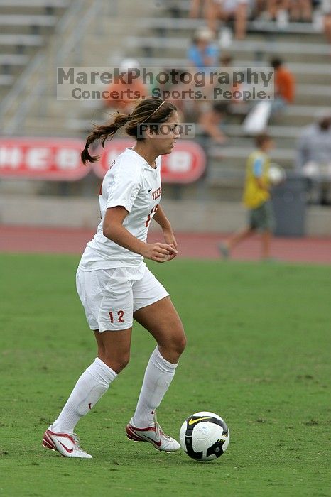 UT sophomore Alisha Ortiz (#12, Forward) in the second half.  The University of Texas women's soccer team won 2-1 against the Iowa State Cyclones Sunday afternoon, October 5, 2008.

Filename: SRM_20081005_13150615.jpg
Aperture: f/5.6
Shutter Speed: 1/1250
Body: Canon EOS-1D Mark II
Lens: Canon EF 300mm f/2.8 L IS