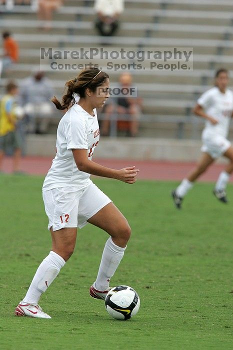 UT sophomore Alisha Ortiz (#12, Forward) in the second half.  The University of Texas women's soccer team won 2-1 against the Iowa State Cyclones Sunday afternoon, October 5, 2008.

Filename: SRM_20081005_13150617.jpg
Aperture: f/5.6
Shutter Speed: 1/1250
Body: Canon EOS-1D Mark II
Lens: Canon EF 300mm f/2.8 L IS