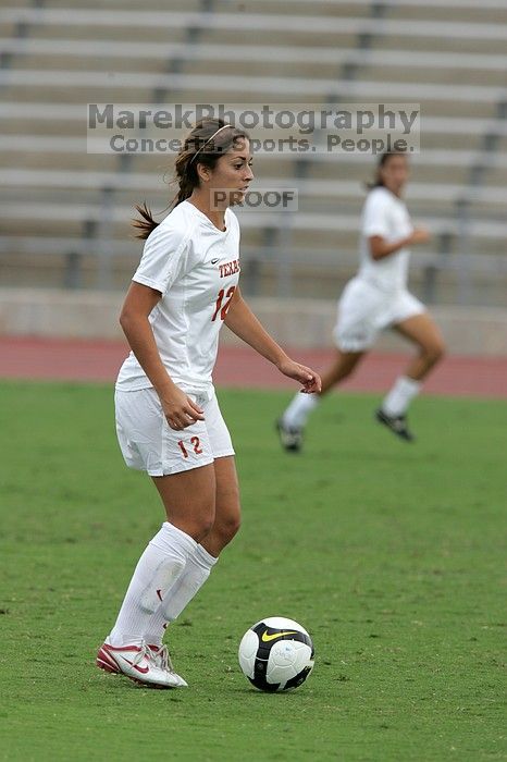 UT sophomore Alisha Ortiz (#12, Forward) in the second half.  The University of Texas women's soccer team won 2-1 against the Iowa State Cyclones Sunday afternoon, October 5, 2008.

Filename: SRM_20081005_13150618.jpg
Aperture: f/5.6
Shutter Speed: 1/1250
Body: Canon EOS-1D Mark II
Lens: Canon EF 300mm f/2.8 L IS