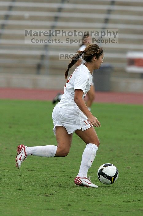 UT sophomore Alisha Ortiz (#12, Forward) in the second half.  The University of Texas women's soccer team won 2-1 against the Iowa State Cyclones Sunday afternoon, October 5, 2008.

Filename: SRM_20081005_13150822.jpg
Aperture: f/5.6
Shutter Speed: 1/1250
Body: Canon EOS-1D Mark II
Lens: Canon EF 300mm f/2.8 L IS