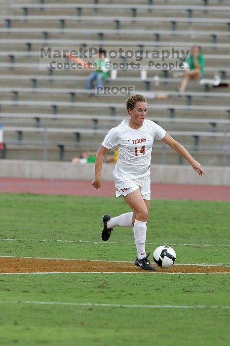 UT senior Kasey Moore (#14, Defender) takes the ball upfield in the second half.  The University of Texas women's soccer team won 2-1 against the Iowa State Cyclones Sunday afternoon, October 5, 2008.

Filename: SRM_20081005_13174856.jpg
Aperture: f/5.6
Shutter Speed: 1/1250
Body: Canon EOS-1D Mark II
Lens: Canon EF 300mm f/2.8 L IS