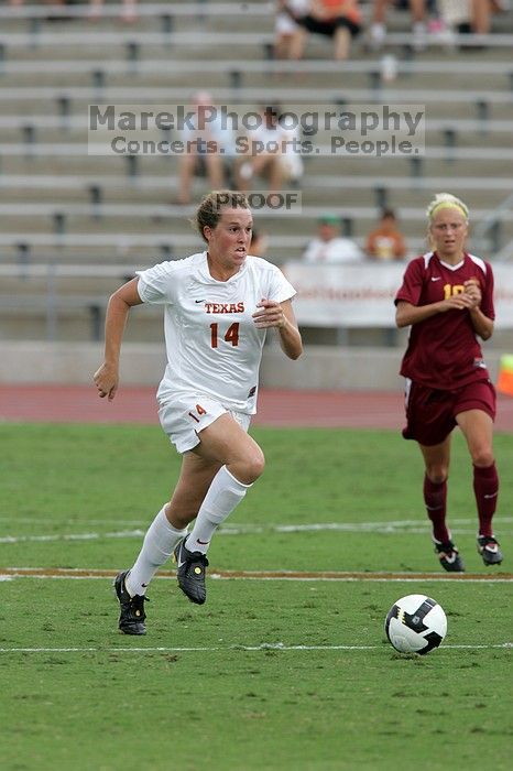 UT senior Kasey Moore (#14, Defender) takes the ball upfield in the second half.  The University of Texas women's soccer team won 2-1 against the Iowa State Cyclones Sunday afternoon, October 5, 2008.

Filename: SRM_20081005_13175264.jpg
Aperture: f/5.6
Shutter Speed: 1/1250
Body: Canon EOS-1D Mark II
Lens: Canon EF 300mm f/2.8 L IS