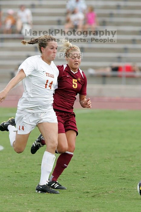 UT senior Kasey Moore (#14, Defender) takes the ball upfield in the second half.  The University of Texas women's soccer team won 2-1 against the Iowa State Cyclones Sunday afternoon, October 5, 2008.

Filename: SRM_20081005_13175474.jpg
Aperture: f/5.6
Shutter Speed: 1/800
Body: Canon EOS-1D Mark II
Lens: Canon EF 300mm f/2.8 L IS