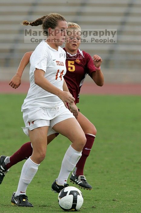 UT senior Kasey Moore (#14, Defender) takes the ball upfield in the second half.  The University of Texas women's soccer team won 2-1 against the Iowa State Cyclones Sunday afternoon, October 5, 2008.

Filename: SRM_20081005_13175679.jpg
Aperture: f/5.6
Shutter Speed: 1/1250
Body: Canon EOS-1D Mark II
Lens: Canon EF 300mm f/2.8 L IS