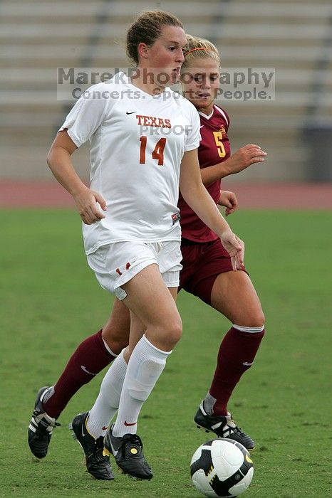 UT senior Kasey Moore (#14, Defender) takes the ball upfield in the second half.  The University of Texas women's soccer team won 2-1 against the Iowa State Cyclones Sunday afternoon, October 5, 2008.

Filename: SRM_20081005_13175681.jpg
Aperture: f/5.6
Shutter Speed: 1/1600
Body: Canon EOS-1D Mark II
Lens: Canon EF 300mm f/2.8 L IS