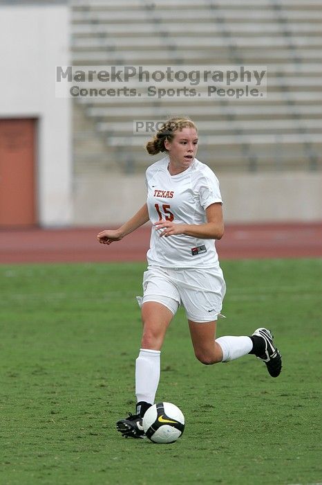 UT freshman Kylie Doniak (#15, Midfielder) crosses the ball in the second half.  The University of Texas women's soccer team won 2-1 against the Iowa State Cyclones Sunday afternoon, October 5, 2008.

Filename: SRM_20081005_13181294.jpg
Aperture: f/5.6
Shutter Speed: 1/1600
Body: Canon EOS-1D Mark II
Lens: Canon EF 300mm f/2.8 L IS